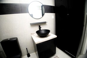 Shower, hair dryer, towels, toilet paper