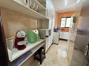 Fridge, microwave, stovetop, coffee/tea maker