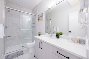 Shower, hair dryer, towels, soap