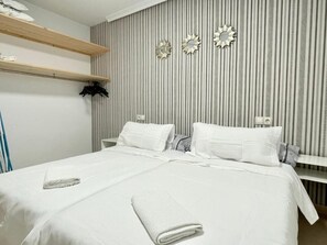 Appartement, vue ville | Coffres-forts dans les chambres, rideaux occultants, Wi-Fi gratuit