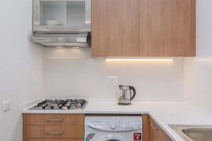 Full-sized fridge, microwave, stovetop, electric kettle