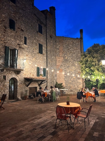 Outdoor dining. Fragolina di Bosco – Room with a View of the Val di Farma