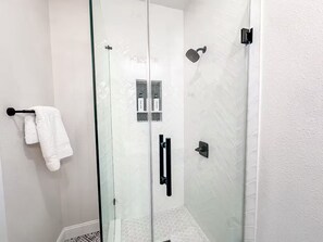 Shower, hair dryer, towels, soap