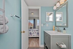 Shower, eco-friendly toiletries, hair dryer, towels