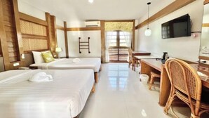 A hotel room with two beds, a desk, a chair, a television, and a window with curtains. - Ruentara Resort & Villa (Buri Ram)