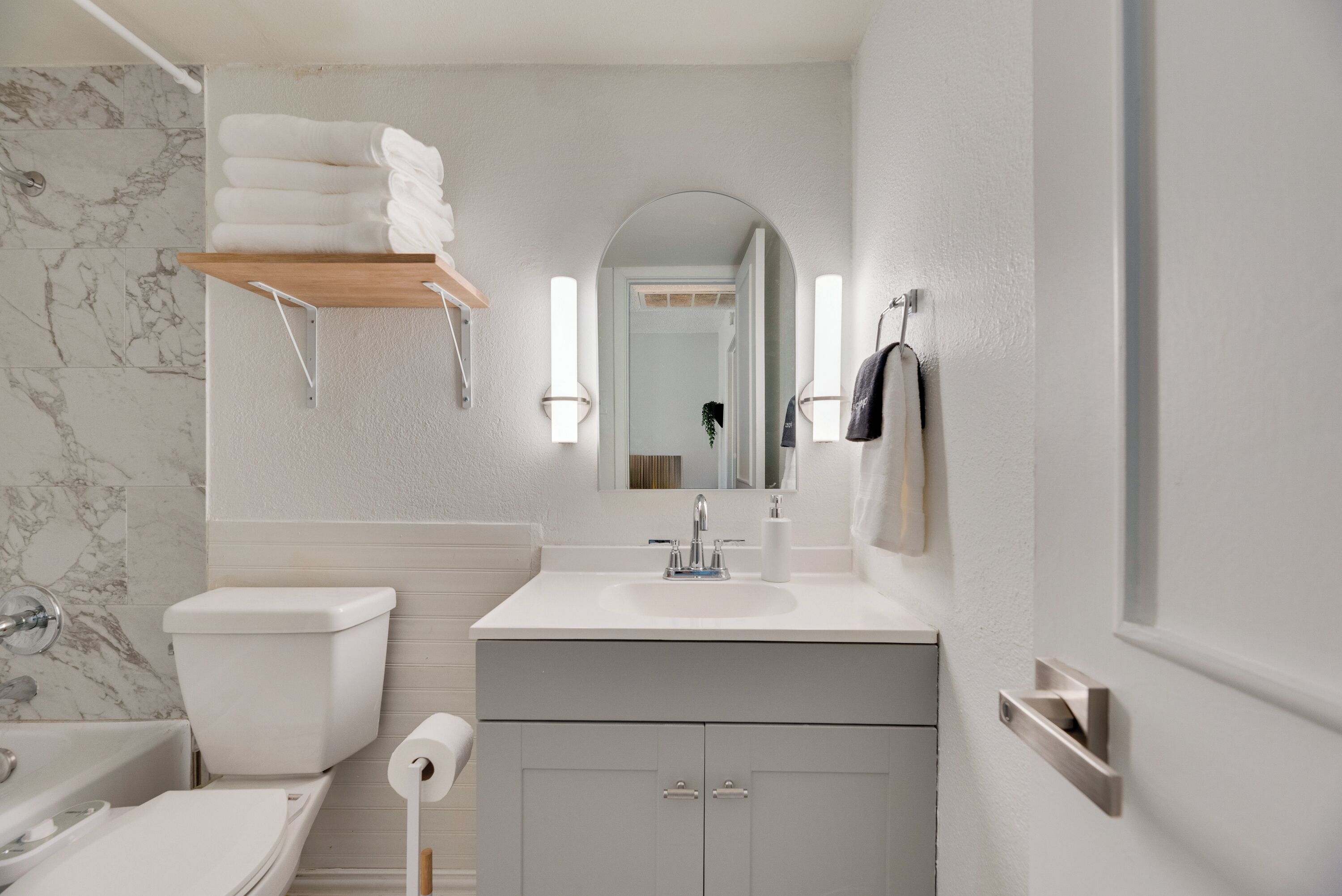 Bidet, towels, soap, toilet paper