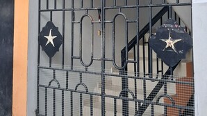 A gated entrance with a metal staircase leading up to a door, featuring decorative star-shaped elements on the gate. - Enchanting private apartment with AC in lively Higuey (Higuey)