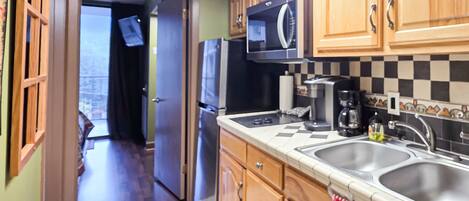 Fridge, microwave, stovetop, coffee/tea maker