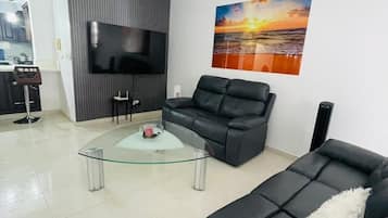 Apartment, Balcony | Living area | 52-inch TV with digital channels, Netflix, streaming services