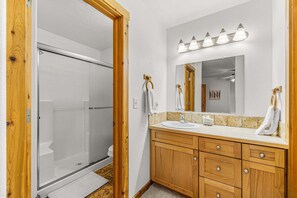 Shower, hair dryer, towels, shampoo