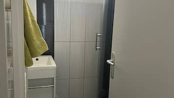 Shower, towels, soap, toilet paper