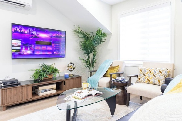 Comfortable, spacious Living area with wall mounted 55 inch Smart TV. Watch Local stations, ROKU TV channels, TUBI TV, & Pluto TV channels for free. You can also log on to your own Netflix or Prime services.