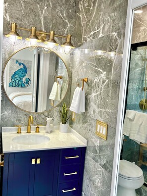 Shower, hair dryer, towels, soap