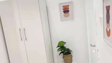 Luxury Apartment, City View | In-room safe, desk, laptop workspace, iron/ironing board