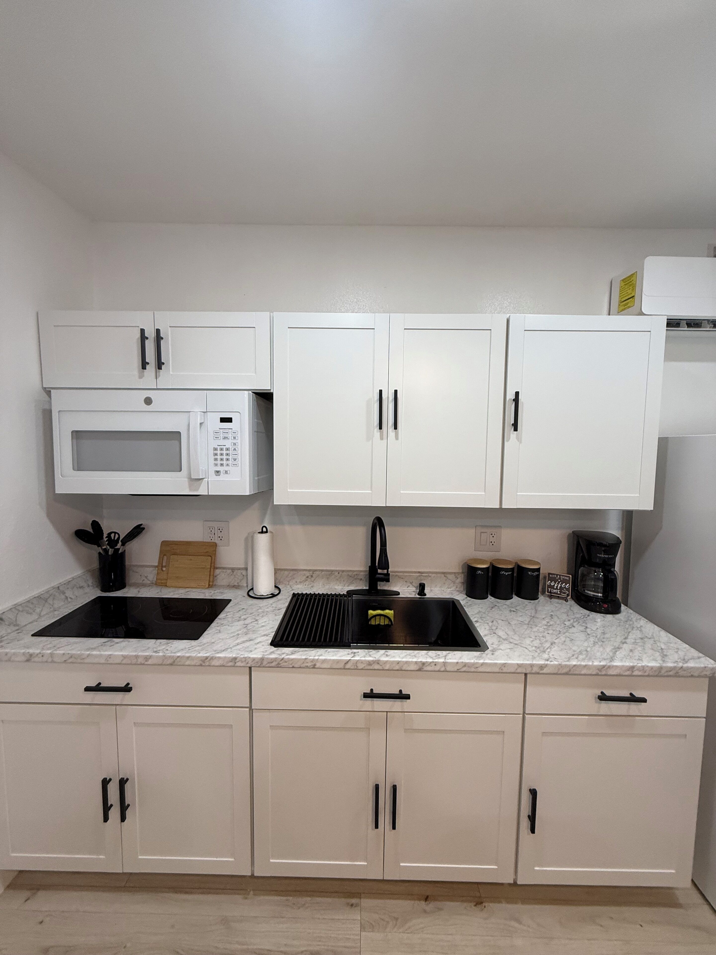 Fridge, microwave, stovetop, coffee/tea maker