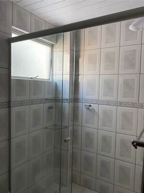 Shower, hair dryer, towels, toilet paper