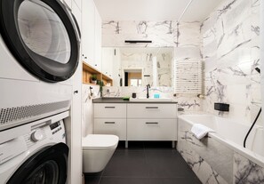 Shower, hair dryer, towels