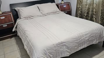 1 bedroom, desk, iron/ironing board, travel crib
