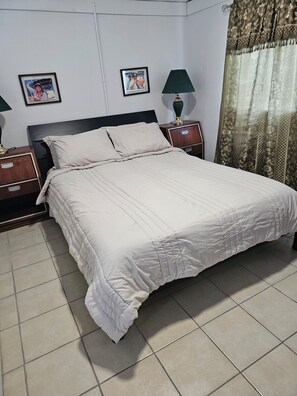 1 bedroom, desk, iron/ironing board, travel crib