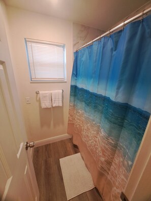 Shower, hair dryer, towels, soap