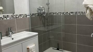 Shower, towels, soap, toilet paper