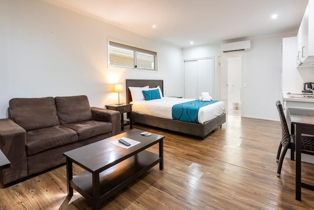 Deluxe Studio, Patio, Garden View | Living area | TV