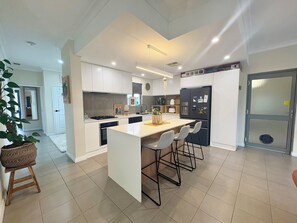 Villa, 2 Bedrooms, Patio, Courtyard View | Shared kitchen | Full-sized fridge, microwave, oven, stovetop