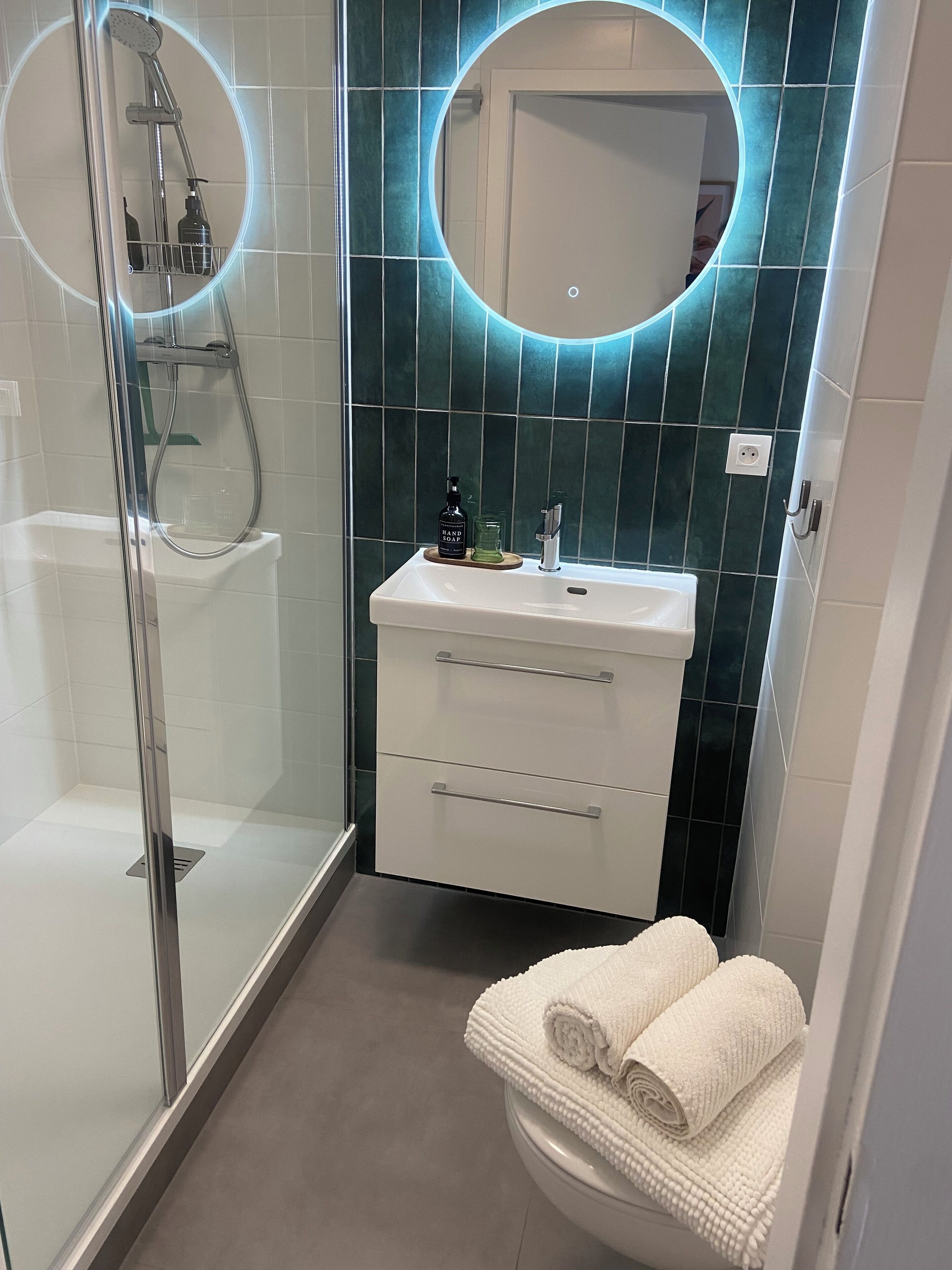 Shower, hair dryer, towels, soap