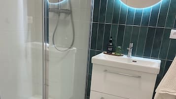 Shower, hair dryer, towels, soap