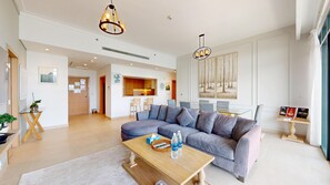 Superior Apartment, Golf View | Living room | 55-inch Smart TV with cable channels