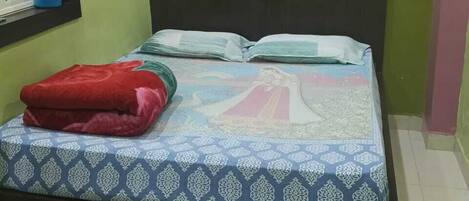 A room with a bed, a chair, a window with curtains, and a wall with a green and pink color scheme.