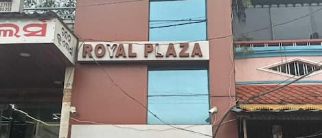 A building with a sign reading "ROYAL PLAZA".