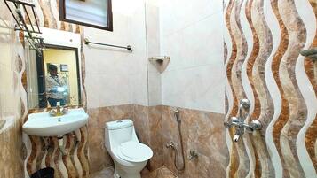 Shower, rainfall showerhead, slippers, towels