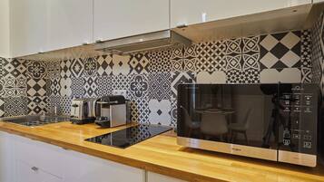 Fridge, microwave, stovetop, coffee/tea maker