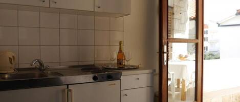 Fridge, microwave, stovetop, coffee/tea maker