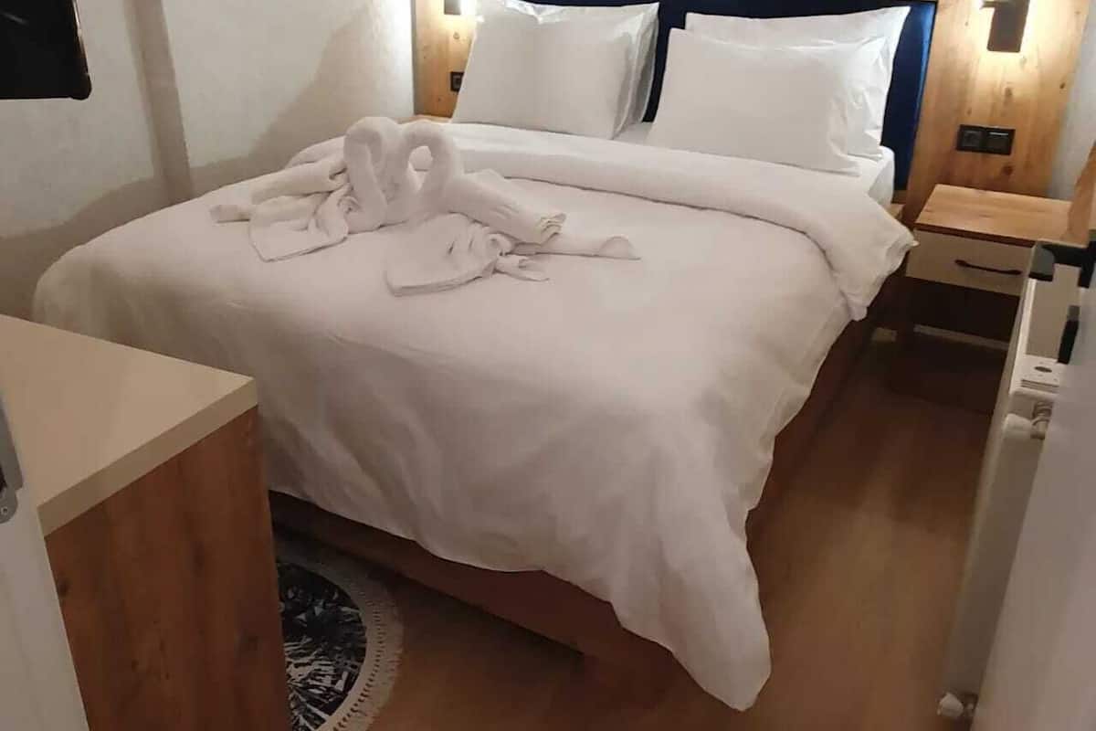 Deluxe Triple Room, Sea View | In-room safe, blackout drapes, soundproofing, iron/ironing board