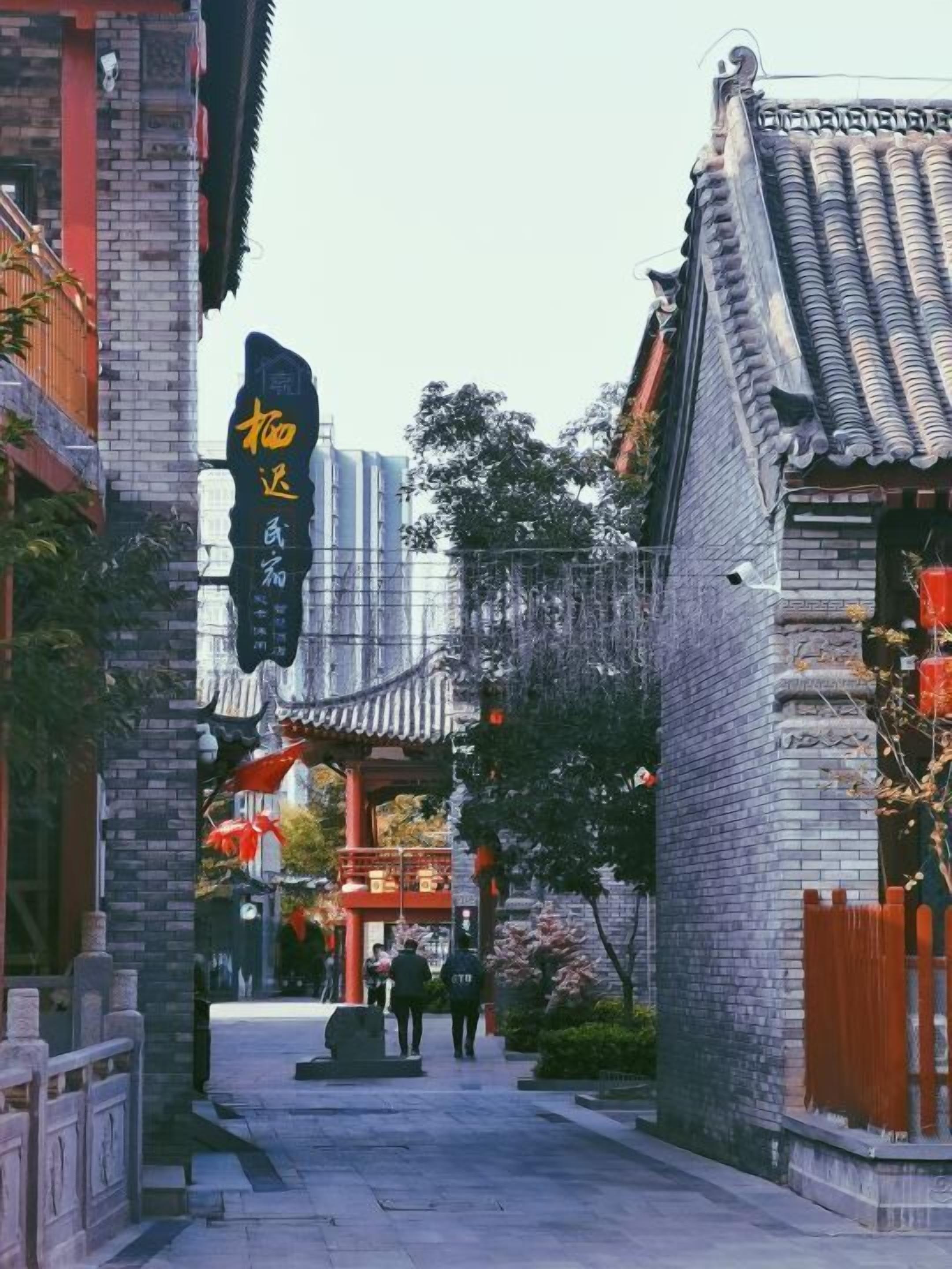 A traditional Chinese architectural style building with a tiled roof and brick walls.
