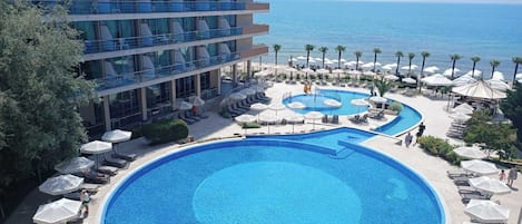 Seasonal outdoor pool, open 9:00 AM to 6:30 PM, pool umbrellas