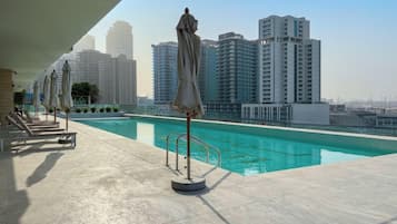 Outdoor pool, pool umbrellas, pool loungers