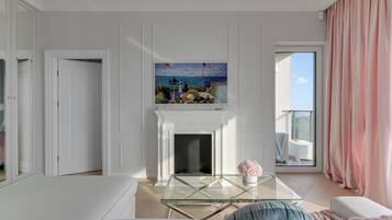 Deluxe Apartment, Hill View | Living area | 35-inch flat-screen TV with satellite channels