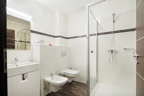 Shower, free toiletries, slippers, soap