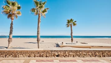 On the beach, sun loungers, beach towels
