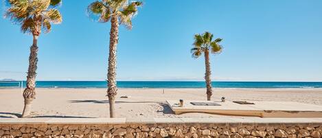 On the beach, sun-loungers, beach towels