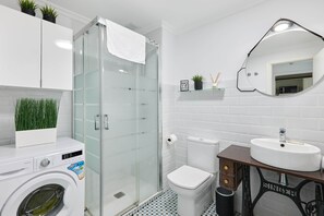 Shower, hair dryer, towels, soap