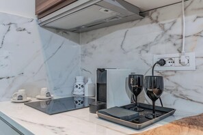 Fridge, microwave, stovetop, coffee/tea maker