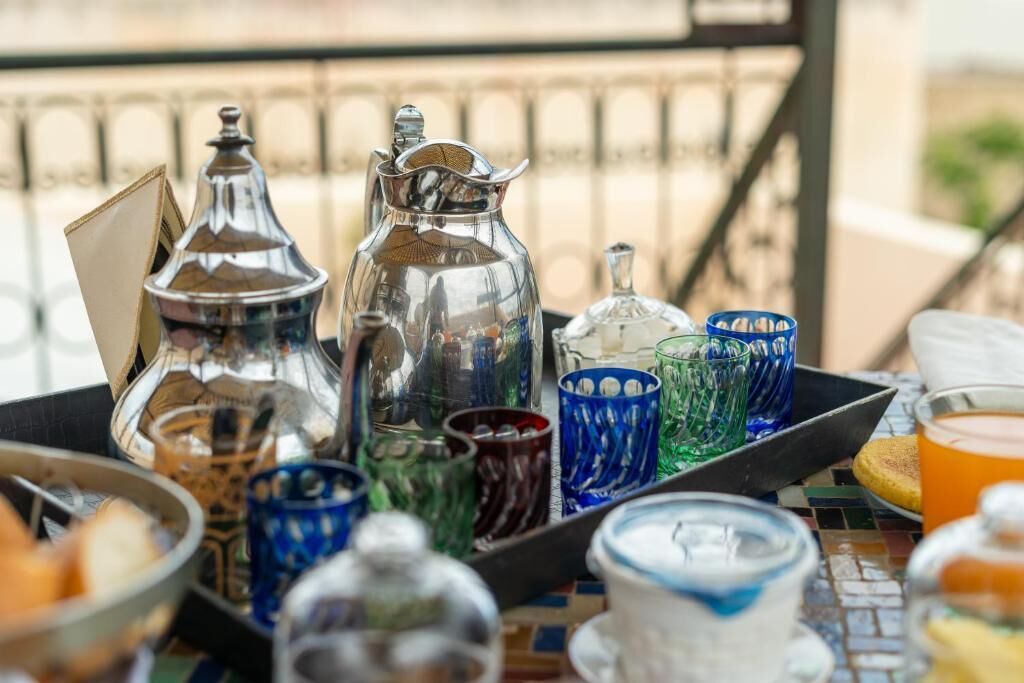 A tray with various glassware and containers, likely for serving beverages.