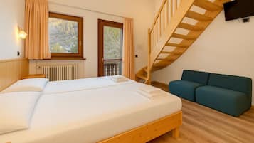 Chambre Quadruple Deluxe | Literie de qualité supérieure, couette en duvet d'oie