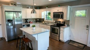Coffee/tea maker, fridge, microwave, oven