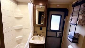 Jetted bath, towels, soap, shampoo