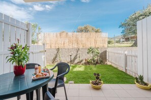 Outdoor dining - Casa Lidia, with Shared Pool, Private Parking and Garden; Bouganville Residence in Viddalba (Viddalba)